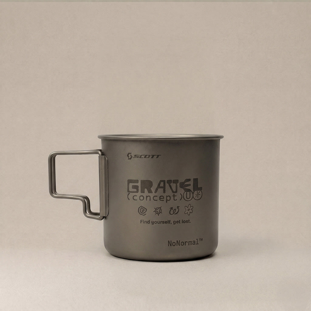 A matte gray Scott Gravel (concept) U camping mug with a square handle, shown on a neutral light gray background.