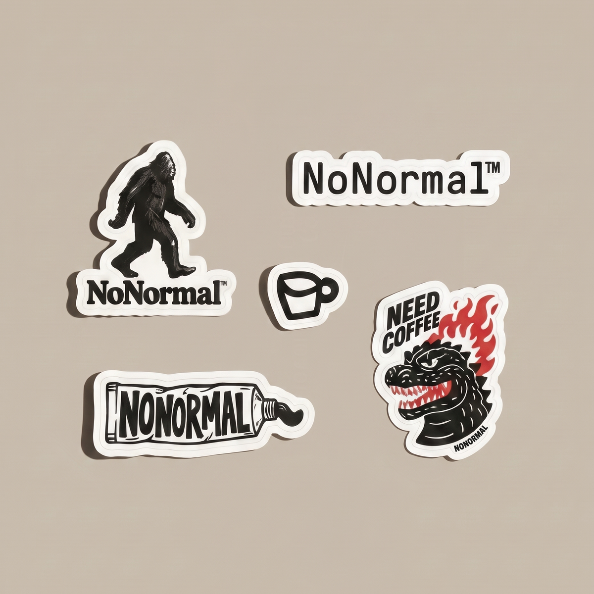 Four die-cut stickers with white borders displayed on a solid beige background. The stickers feature the word 'NoNormal' in different stylized designs, including a gorilla silhouette, a coffee cup, a paint tube, and a Godzilla-like dragon head with flames and the words 'NEED COFFEE'.
