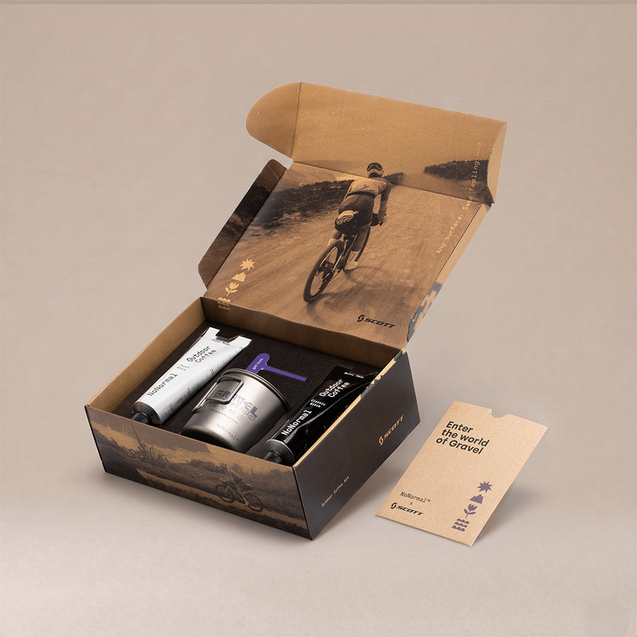 The open Scott Gravel Kit box with both tubes, the cup and the booklet