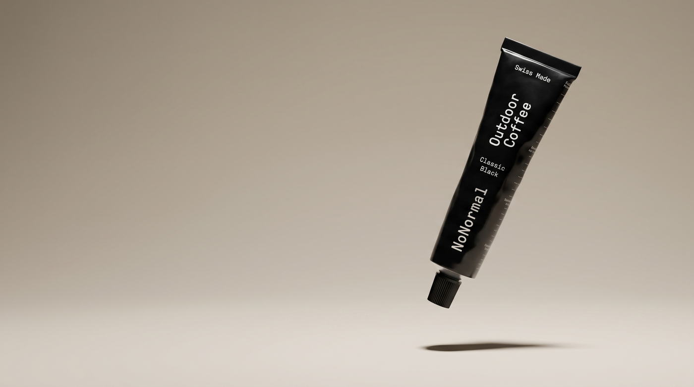 NoNormal Classic Black tube floating over a warm greige studio ground