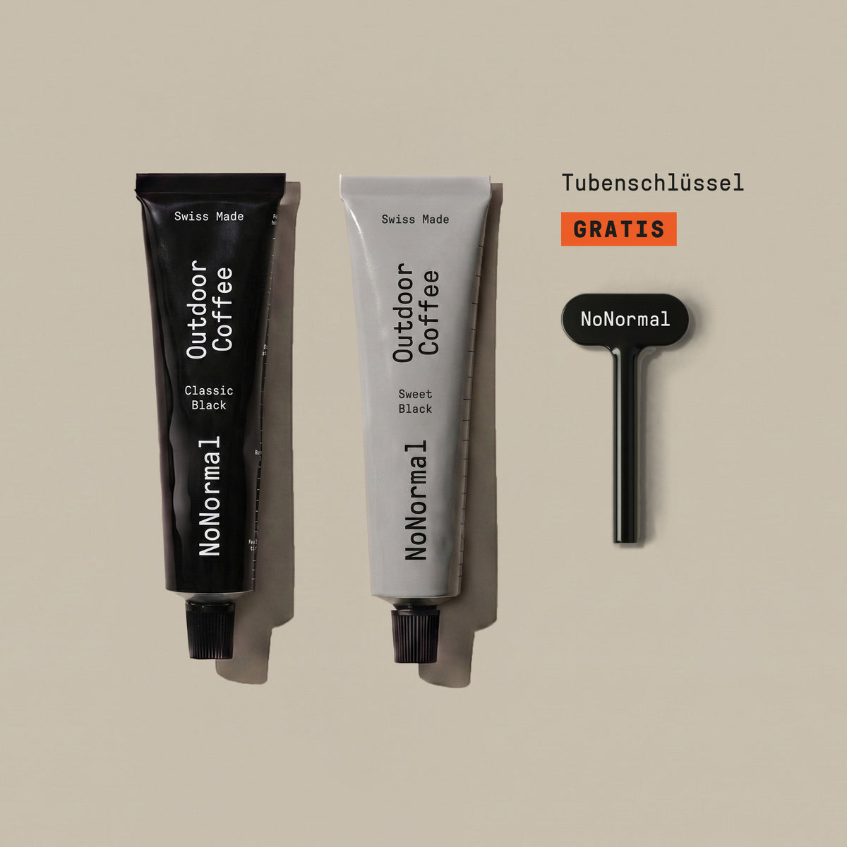 The NoNormal Welcome Bundle on a warm beige background: a Classic Black tube, a Sweet Black tube and the black tube squeeze key, labelled as free.